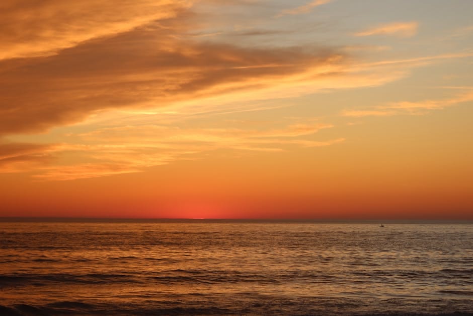 Beautiful sunset over beach with vibrant orange sky - Sri Lanka sunsets