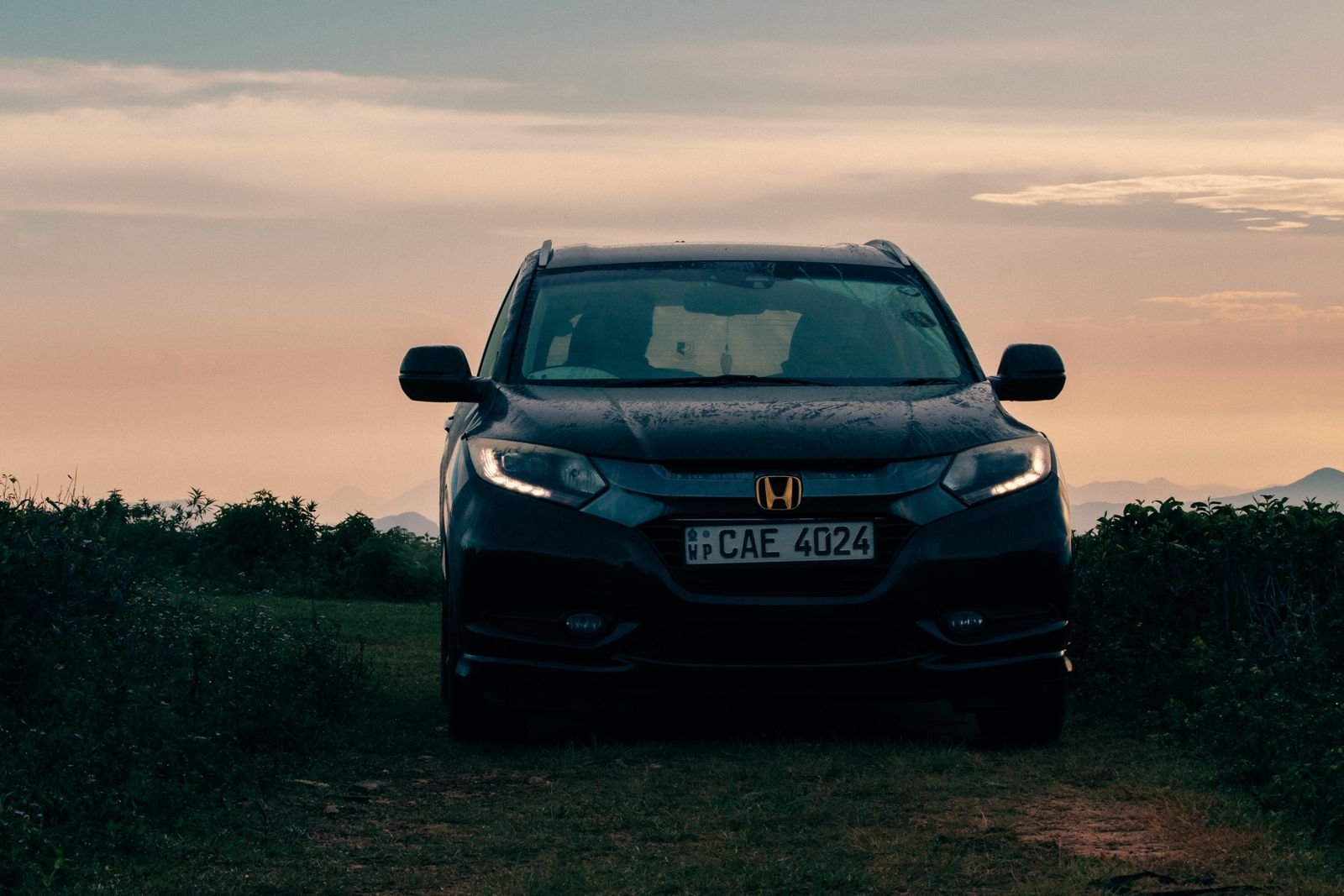 Car parked on a rural hilltop in Madulsima at sunset