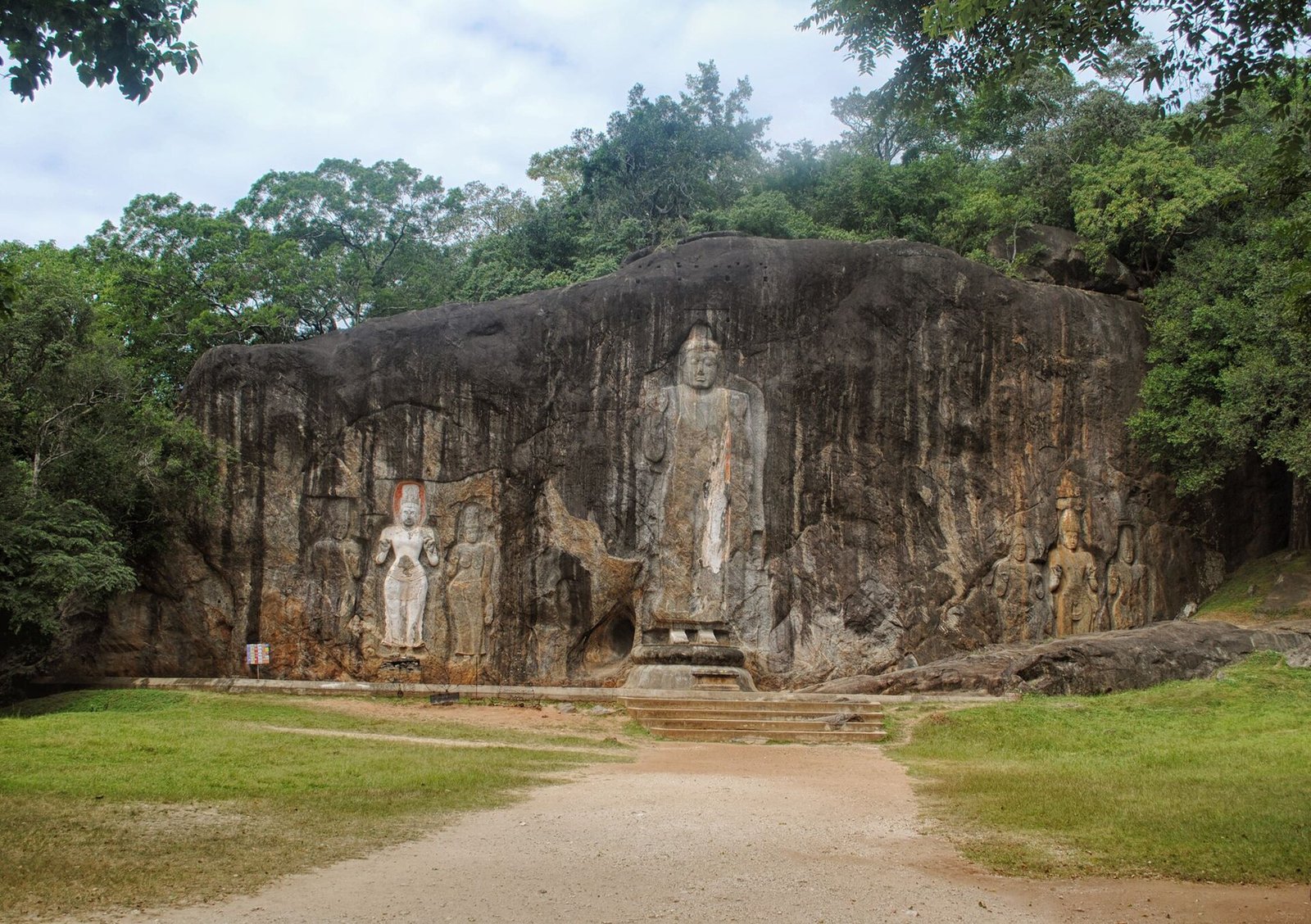 Rock-carved Buddha figures at Buduruwagala in the jungle near Wellawaya