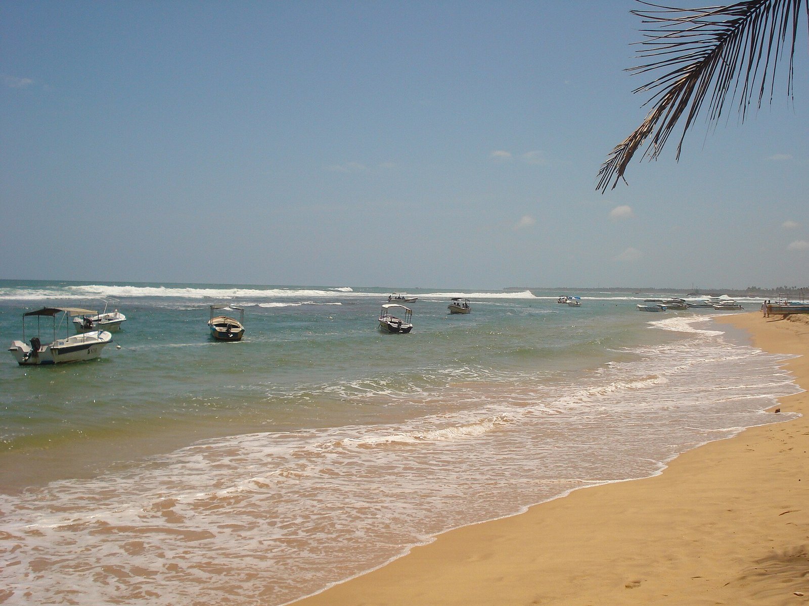 Fishing boats anchored off the beach at Hikkaduwa
