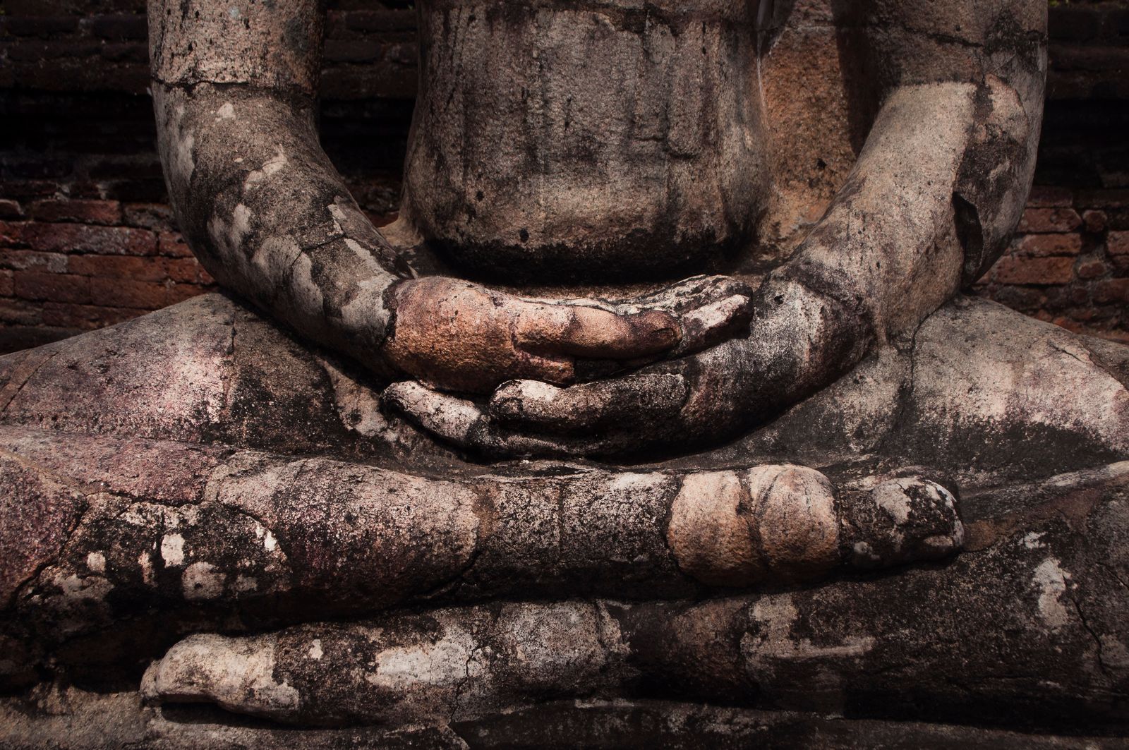 Hands of a weathered Buddha statue in meditative pose at Polonnaruwa Hands of a weathered Buddha statue in meditative pose at Polonnaruwa